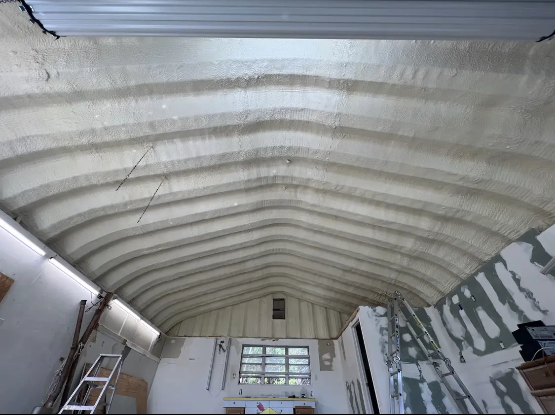 Spray polyurethane foam applied to the underside of a metal roof deck in West Hazleton